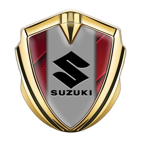 Suzuki Emblem Logo Schriftzug Aufkleber Goldtonfarbe Rote Detsils Fundament und Grau Logo Panel