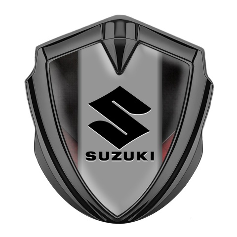 Suzuki Emblem Logo Schriftzug Aufkleber Graphit Tonfarbe Schwarz Rote Texture Hintergrund mit Grau Logo Panel