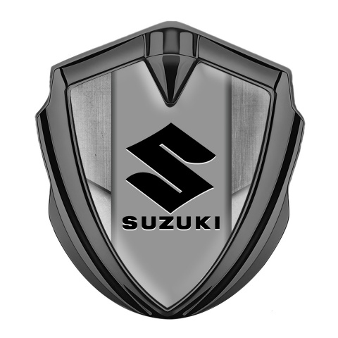 Suzuki Emblem Abzeichen Graphit Tonfarbe Steinstruktur Hintergrund mit Schwarz Logo
