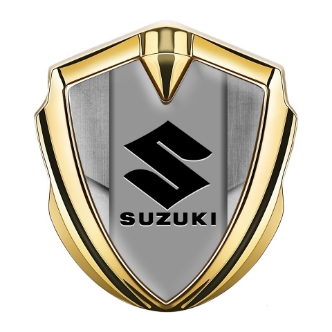 Suzuki Emblem Abzeichen Goldtonfarbe Steinstruktur Hintergrund mit Schwarz Logo