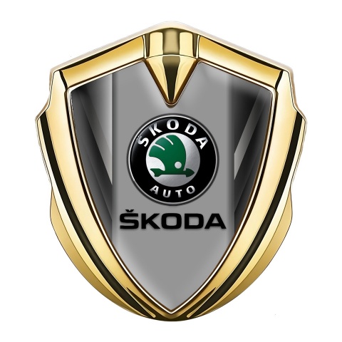 Skoda Emblem Abzeichen selbstklebend Goldtonfarbe mit Grau Fragmente und Grau Logo Panel