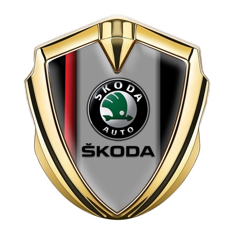 Skoda Emblem Auto Zeichen Goldtonfarbe mit Rote Linie auf schwarzem Sockel Design