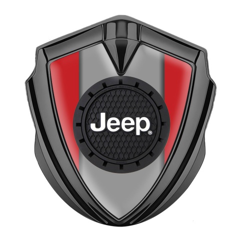 Jeep Emblem Logo Schriftzug Aufkleber Graphit Tonfarbe Rote Hintergrund mit Rudes logo