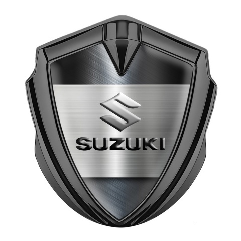 Suzuki Emblem Abzeichen Graphit Tonfarbe Matt Fundament mit Grau Logo