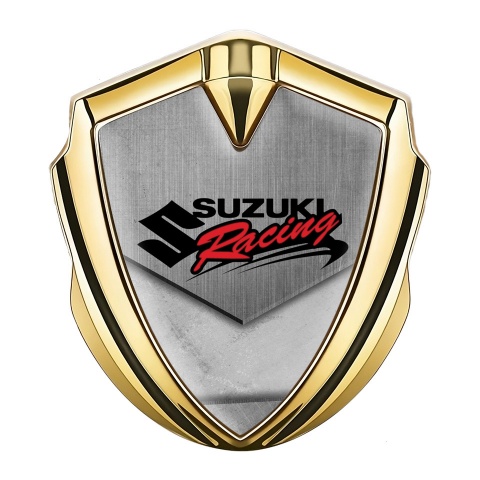 Suzuki Emblem Auto Zeichen Goldtonfarbe Asphalt mit Steinen Fundament und Racing Logo