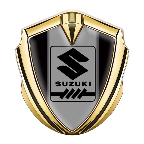 Suzuki Emblem Abzeichen selbstklebend Goldtonfarbe Schwarz Basis mit Grau Logo Panel