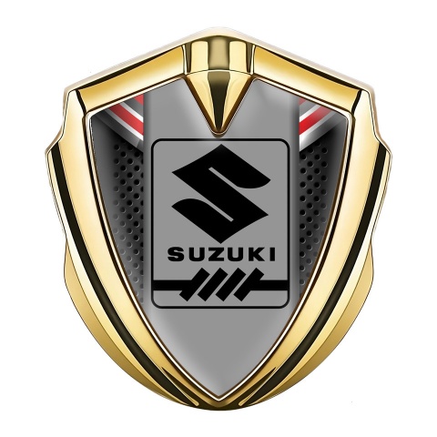 Suzuki Emblem Abzeichen selbstklebend Goldtonfarbe Dunkles Gitter mit Rote Fragmente Design