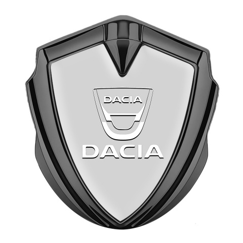 Dacia Abzeichen selbstklebend Graphit Tonfarbe Grau Basis mit Weiss Logo