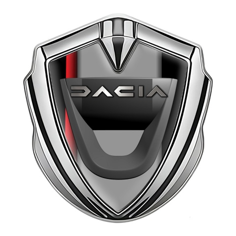 Dacia Emblem Auto Zeichen Silbertonfarbe Schwarz Basis mit rote Band Motiv
