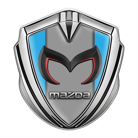 Mazda Emblem Abzeichen Silbertonfarbe mit Himmelblau Basis und Grau Logo Panel