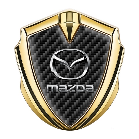 Mazda Emblem Abzeichen selbstklebend Goldtonfarbe mit Schwarz Carbon Hintergrund und Klassisch Logo