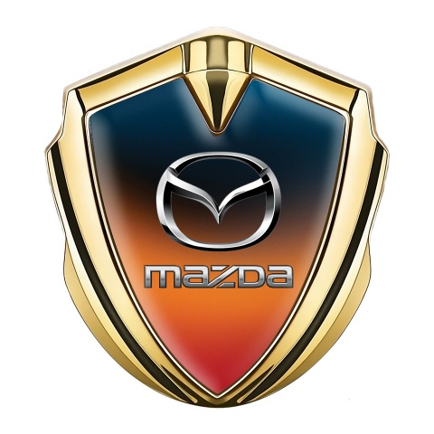Mazda Emblem Abzeichen Goldtonfarbe mit Orange Blau Fundament und Klassisch Logo
