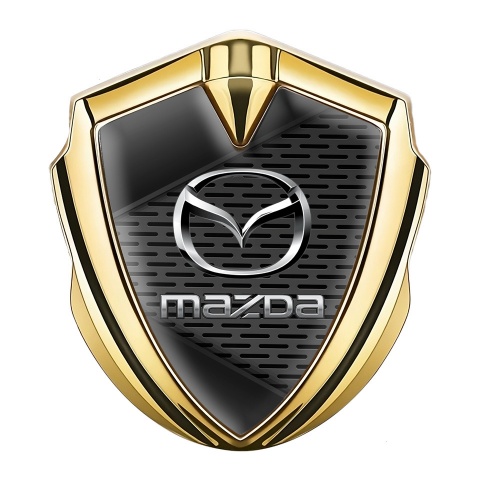 Mazda Seitenflugel Emblem Aufkleber Goldtonfarbe mit Mesh Ornament Hintergrund und Silber Logo