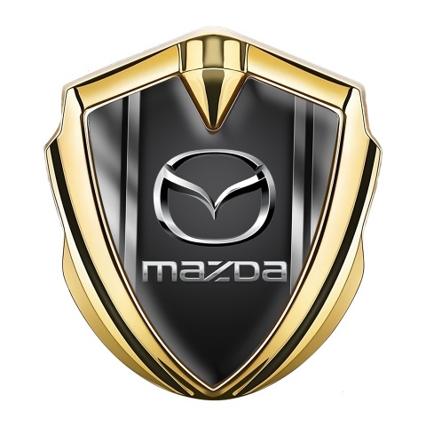 Mazda Emblem Abzeichen selbstklebend Goldtonfarbe mit Metallrahmen Basis und Graphite Logo Panel