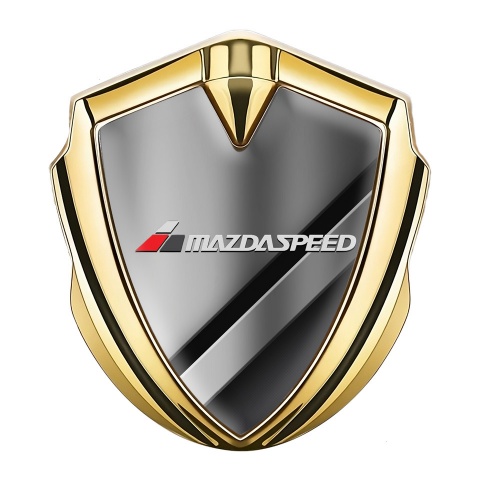 Mazda Emblem Abzeichen Goldtonfarbe mit Diagonale Metallelemente Basis und Grau Logo