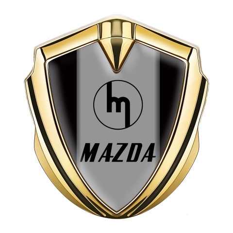 Mazda Emblem Abzeichen Goldtonfarbe mit Schwarz Vorlage und Retro Logo Stil
