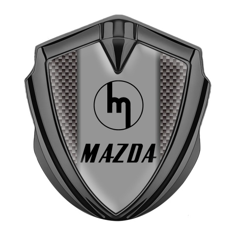 Mazda Emblem Abzeichen selbstklebend Graphit Tonfarbe mit Braun Carbon und Retro Logo