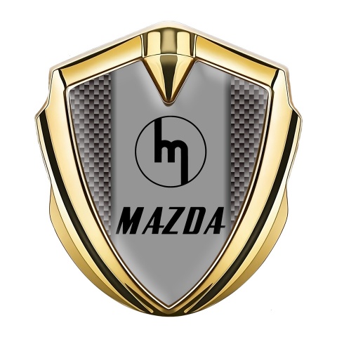 Mazda Emblem Abzeichen selbstklebend Goldtonfarbe mit Braun Carbon und Retro Logo