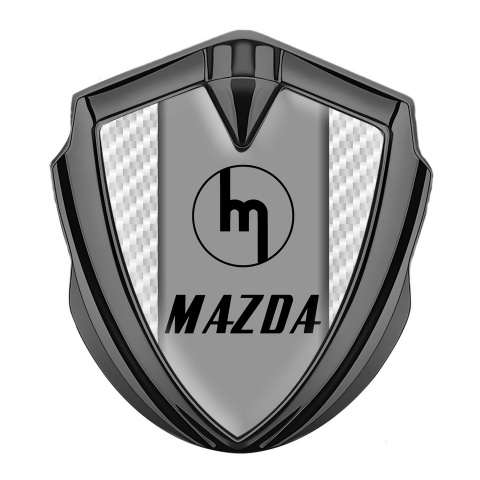 Mazda Emblem Auto Zeichen Graphit Tonfarbe mit Weiss Kohlenstoff Hintergrund und Retro Logo