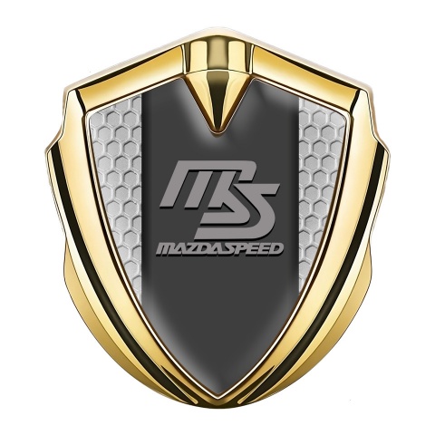 Mazda Speed Emblem Abzeichen Goldtonfarbe mit Wabeneffekt Hintergrund und Graphit Panel Logo