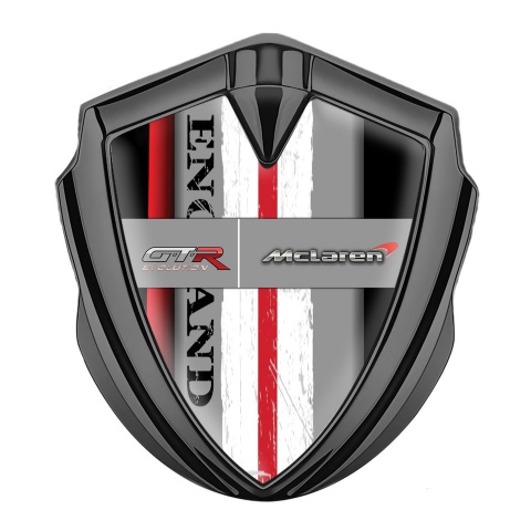 Mclaren GTR Emblem Abzeichen Graphit Tonfarbe Schwarz Basis mit Rote Band England Logo Stil