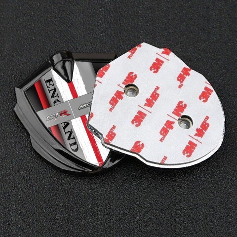Mclaren GTR Emblem Abzeichen Graphit Tonfarbe Schwarz Basis mit Rote Band England Logo Stil