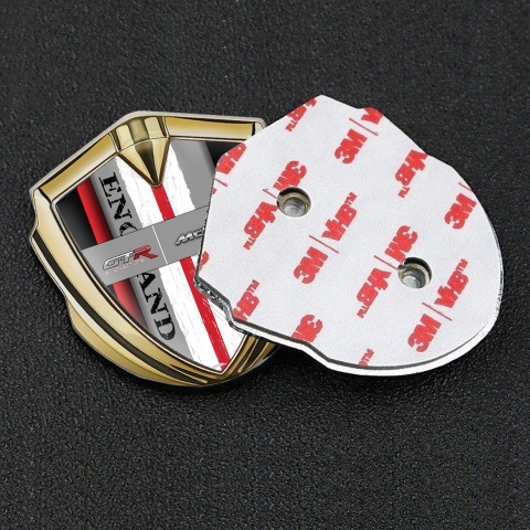 Mclaren GTR Emblem Abzeichen Goldtonfarbe Schwarz Basis mit Rote Band England Logo Stil
