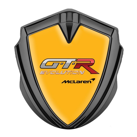 Mclaren GTR Abzeichen selbstklebend Graphit Tonfarbe Orange Basis Evolution logo