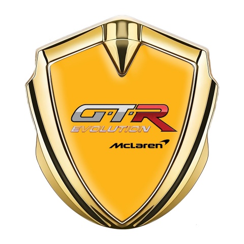 Mclaren GTR Abzeichen selbstklebend Goldtonfarbe Orange Basis Evolution logo