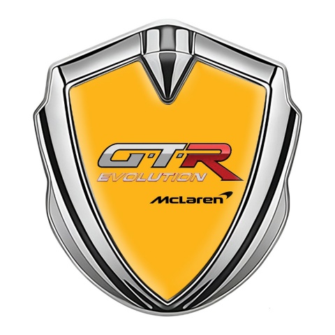 Mclaren GTR Abzeichen selbstklebend Silbertonfarbe Orange Basis Evolution logo