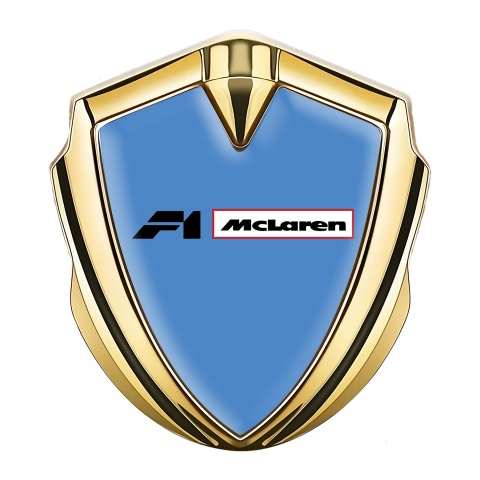 Mclaren Abzeichen selbstklebend Goldtonfarbe Blau Hintergrund mit F1 Logo
