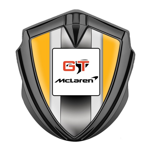 Mclaren Abzeichen selbstklebend  Graphit Tonfarbe Orange Basis mit GT Logo Stil