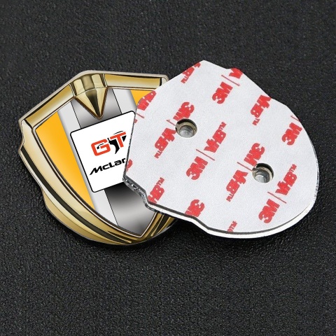Mclaren Abzeichen selbstklebend Goldtonfarbe Orange Basis mit GT Logo Stil