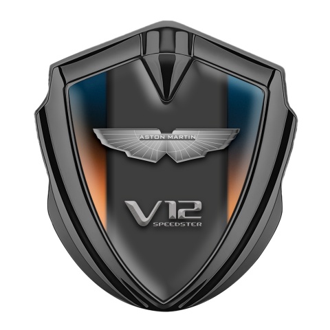 Aston Martin Seitenflugel Emblem Aufkleber Graphit Tonfarbe mit Orange Blau Basis und V12 Logo