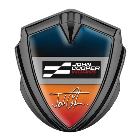 Mini Cooper John Cooper Emblem Abzeichen selbstklebend Graphit Tonfarbe mit Blau Orangefarbenes Grundmotiv