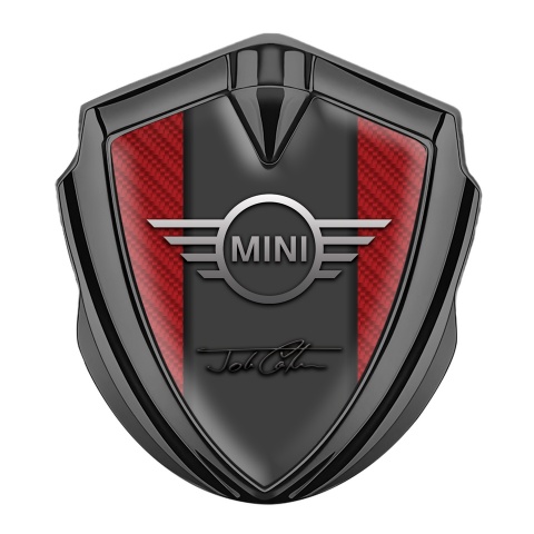 Mini Cooper Abzeichen selbstklebend Graphit Tonfarbe mit Rot Carbon und John Cooper Unterschrift