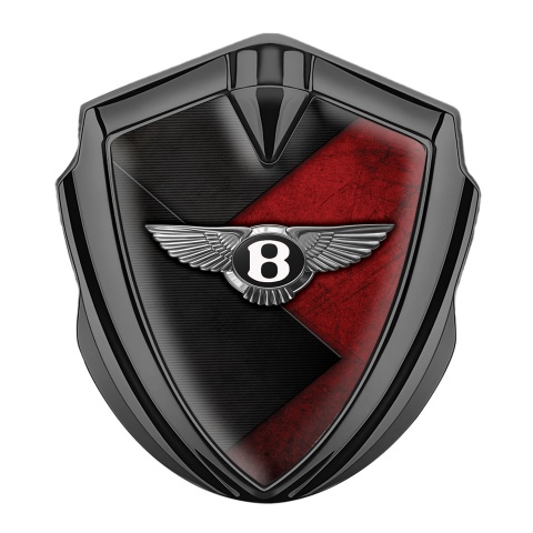 Bentley Selbstklebendes Metallaufkleber Emblem Graphit Tonfarbe mit Schwarz Rote Textur Hintergrund