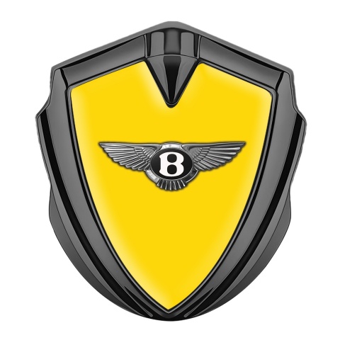 Bentley Emblem Auto Zeichen Graphit Tonfarbe mit Gelb Hintergrund und Klassisch Logo