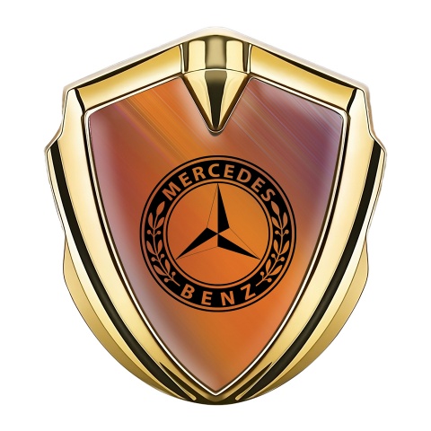 Mercedes Benz Emblem Logo Schriftzug Aufkleber mit Goldtonfarbe Orange Hintergrund